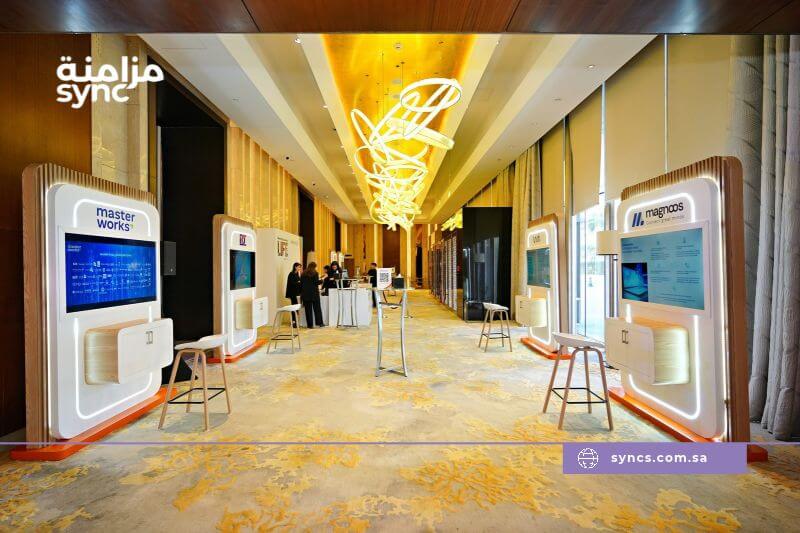 Exhibitor capturing a qualified visitor lead during a business conversation at a Saudi exhibition stand