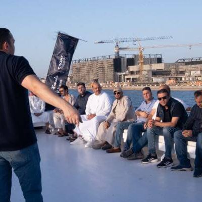 Guests engaged in FIFA tournament and card games on a yacht