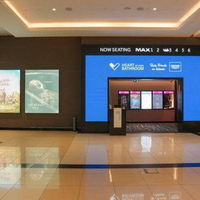 Branded bowling lane screens displaying GROHE visuals during a corporate gathering